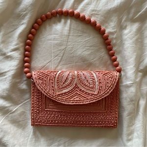 Pink beaded clutch
